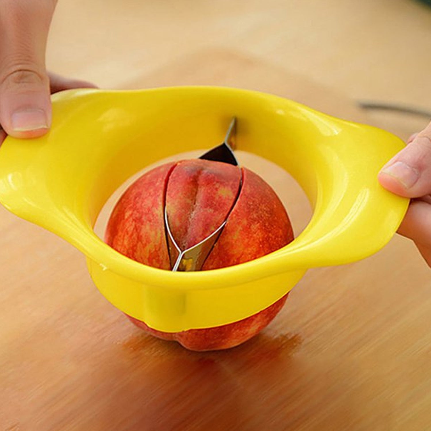 Wukusy Mango Cutter Chopper Slicer with stainless steel blade for easy mango slicing and peeling in the kitchen.