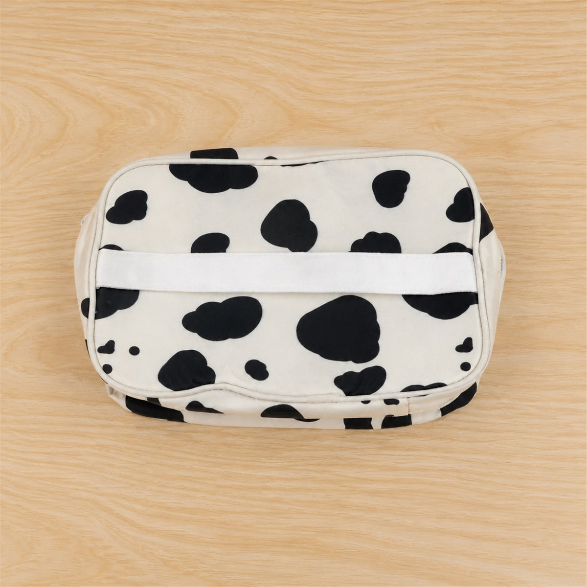 Spotted Wukusy makeup zipper pouch with carry handle, ideal for travel organization, measuring 24x15 cm.