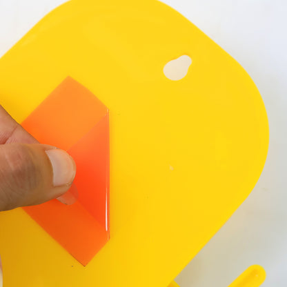 Orange wall-mounted mobile stand with hook by Wukusy, designed for convenient mobile device and accessory storage.
