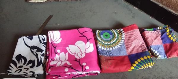 Pair of floral and abstract printed polycotton double bedsheets from Drpshippr, showing vibrant patterns on soft fabric.