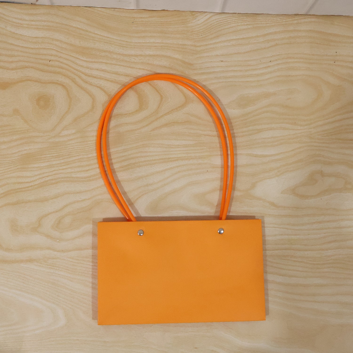 Foldable flower packaging bag with handle by Wukusy, designed for bouquets and gift presentation, shown in the image.