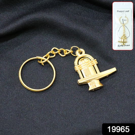 Golden metal Shivling keychain from Wukusy, featuring detailed Shivling design, attached to a keyring for everyday use.