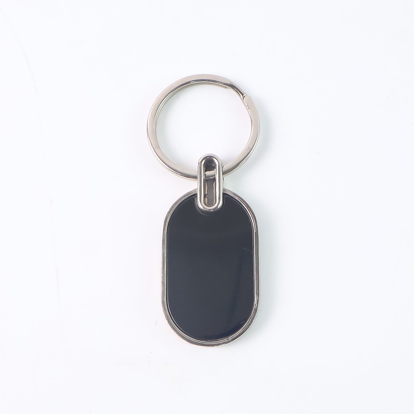 Elegant black and silver oval metal keychain by Wukusy, featuring a sleek design and durable metal construction.