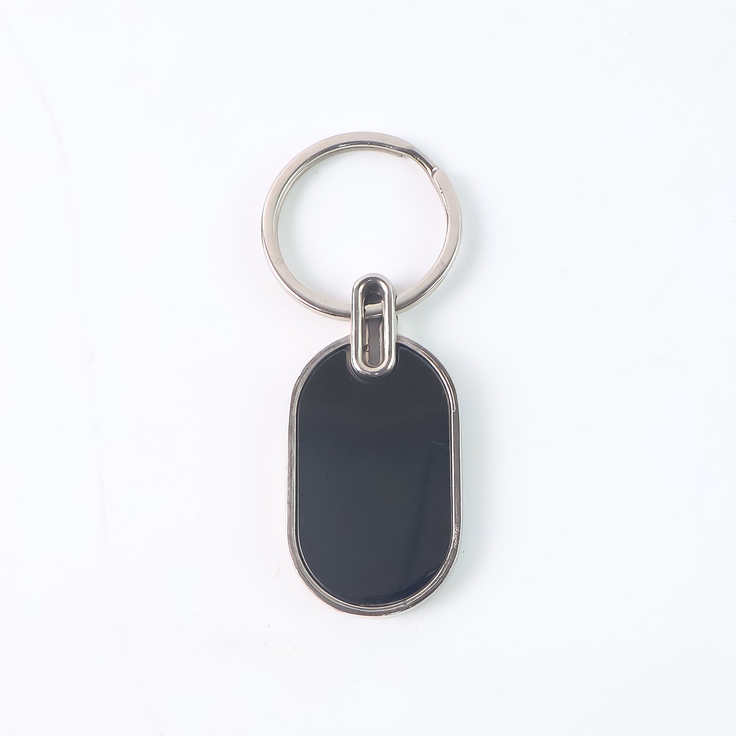 Elegant black and silver oval metal keychain by Wukusy, featuring a sleek design and durable metal construction.