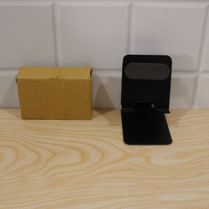 Wukusy foldable metal mobile phone stand with adjustable angle, desk use, compact design, black finish, and secure phone holder.