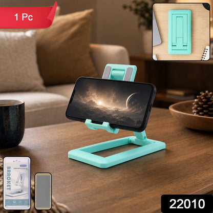 Wukusy foldable plastic mobile phone holder stand on a desk, adjustable for office use, showcasing its compact, portable design.