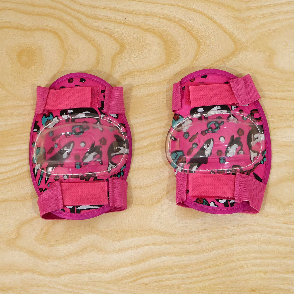 Pair of Wukusy adjustable kids elbow protection pads for cycling, skating, and scooter play, featuring padded cushioning and adjustable straps.