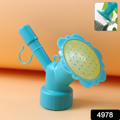 Wukusy universal plastic water bottle sprinkler head nozzle attached to a water bottle for garden watering.