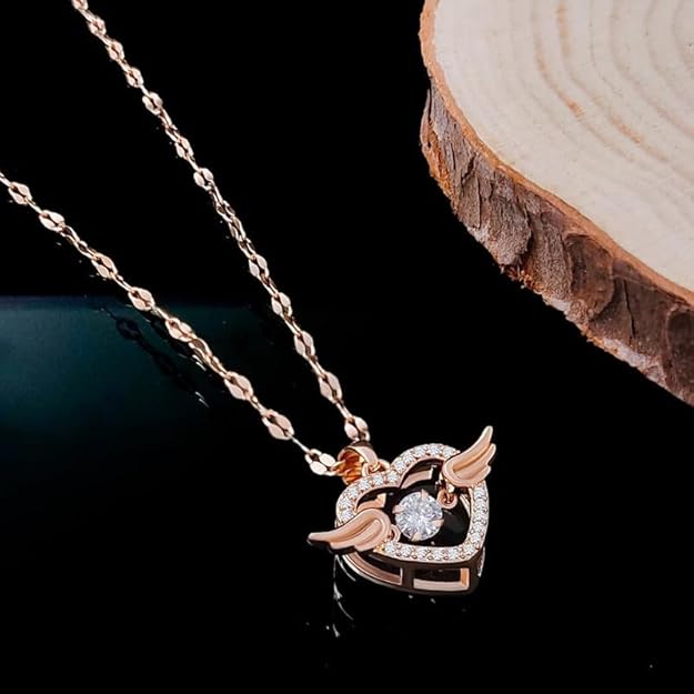 Rose gold stainless steel chain pendant necklace featuring a flying feather and heart with cubic zirconia for women.
