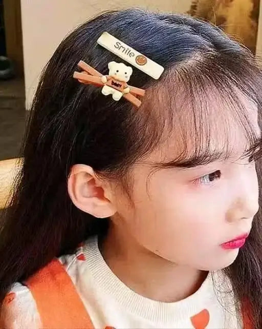 14-piece Ekom Teddy Bow hair clips set with small multicolor rubber clips for hair styling and accessories.