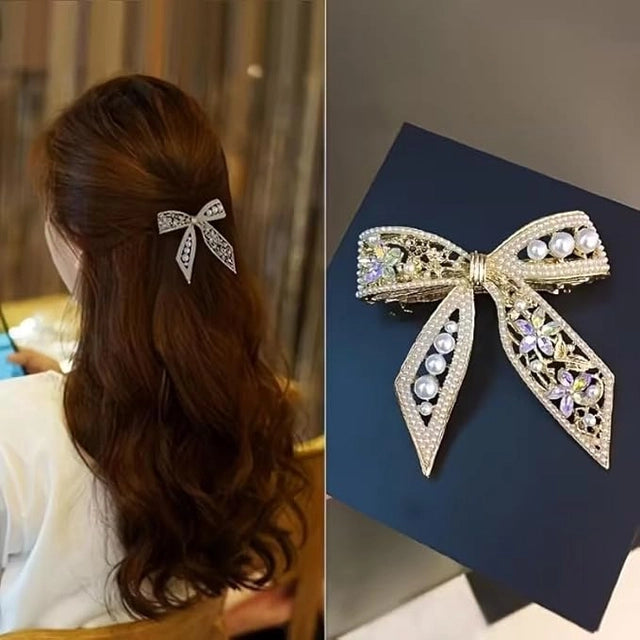 Gold plated pearl hair clip with bowknot design, CZ stones, French barrette for women, suitable for weddings and special occasions.