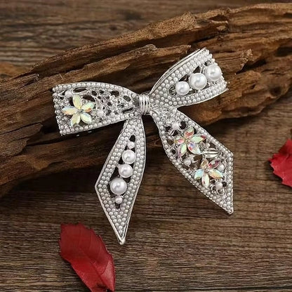 Gold plated pearl hair clip with bowknot design, CZ stones, French barrette for women, perfect for festivals and weddings.