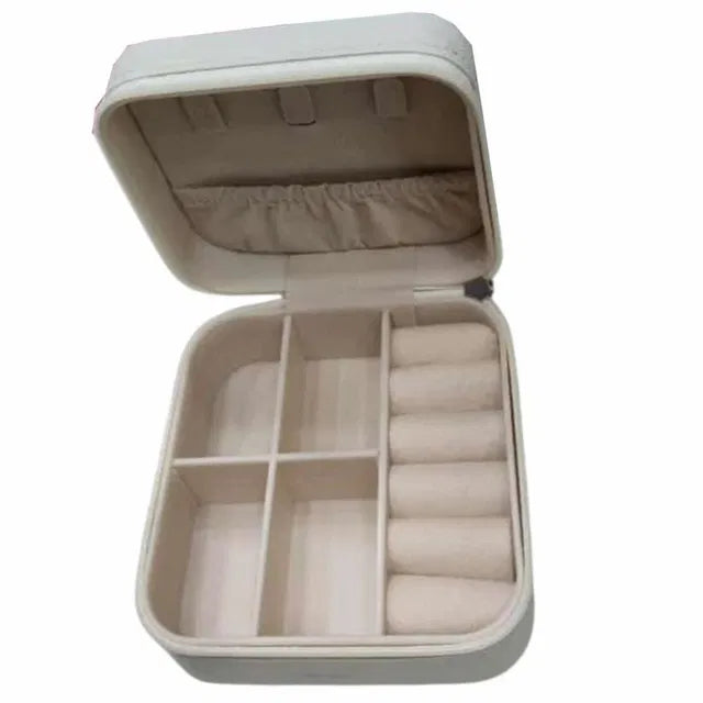 Rectangle peach leather jewelry and makeup kit box from 19357 with compartments for organizing accessories and cosmetics.