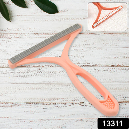 Wukusy portable hair and lint remover, handheld device with cleaning brush for clothing and fabric care.