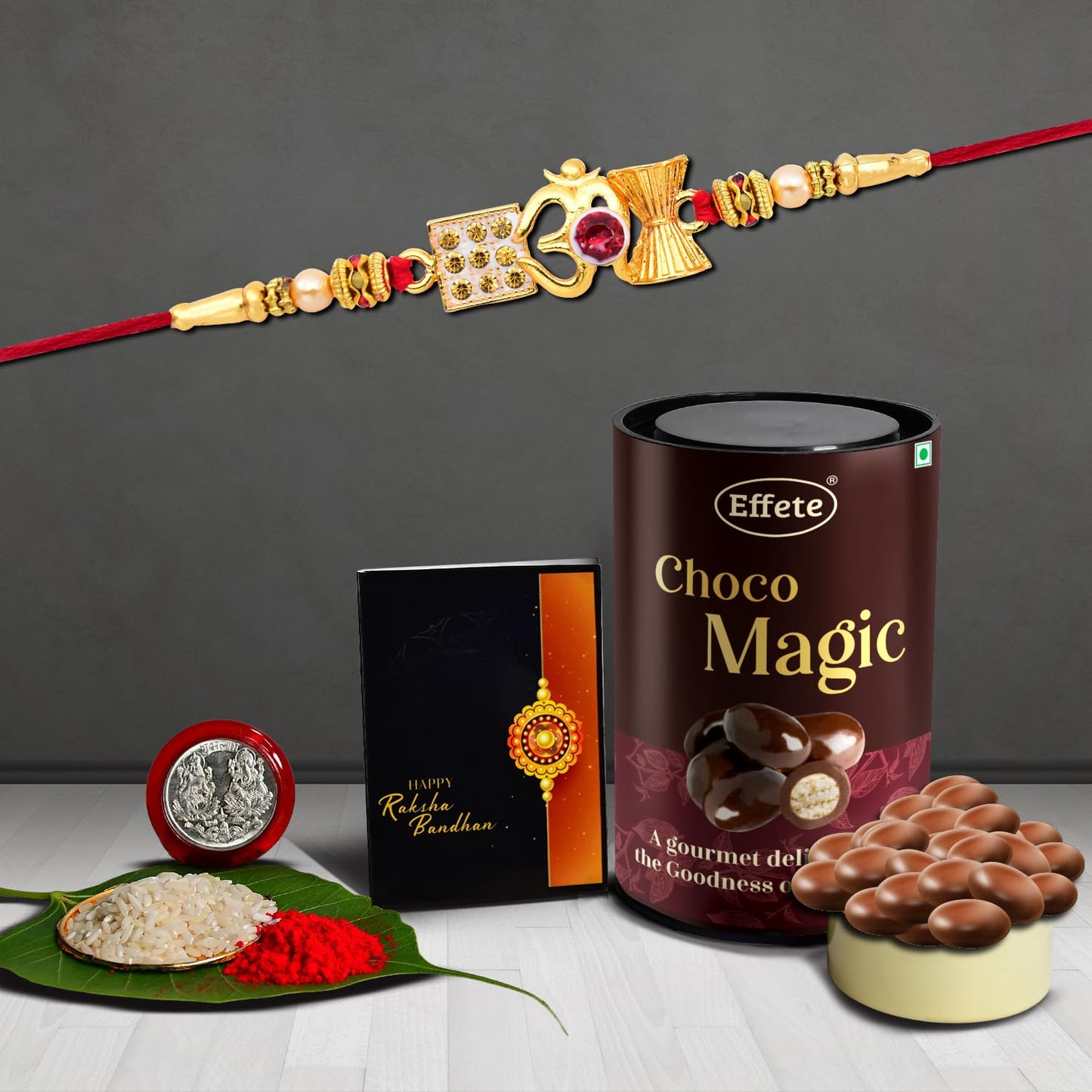 Wukusy Lord Shiva Damru Rakhi for brother with chocolate, featuring traditional design and decorative elements.