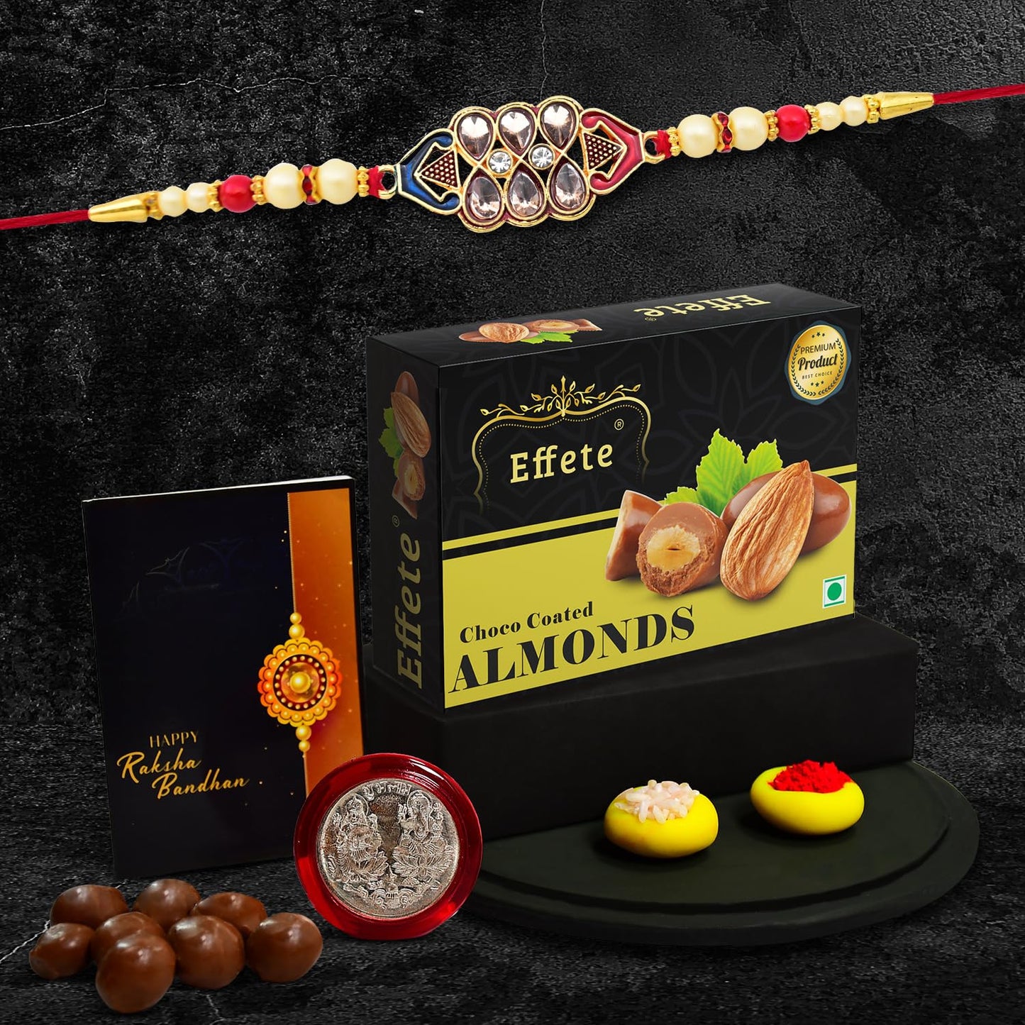 Wukusy diamond Rakshabandhan Rakhi for brother with a decorative design and a small box of chocolate almonds, 32g.