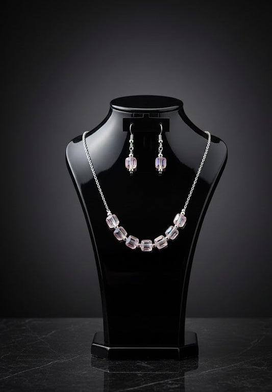 Silver plated artificial stones studded jewelry set with intricate design, featuring earrings and a matching necklace from Drpshippr
