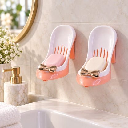 Pair of shoe-shaped shower soap holders with drainage and suction mounts, black and white design by Wukusy.