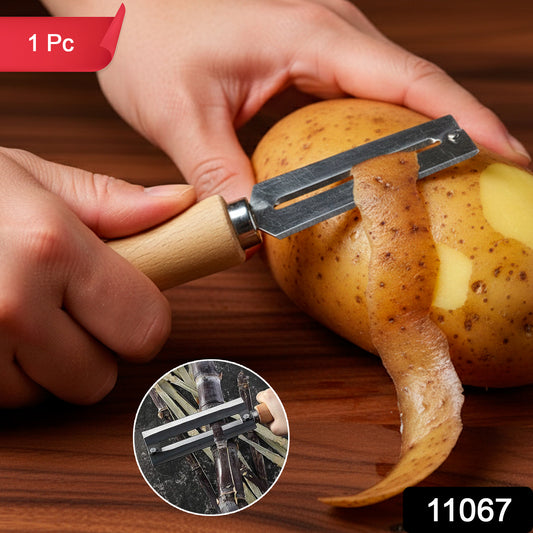 Wukusy stainless steel vegetable peeler with ergonomic handle and sharp blade for peeling carrots, potatoes, and other vegetables.