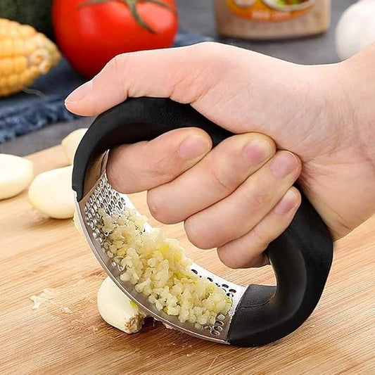 Drpshippr stainless steel garlic press crusher for home and kitchen, showing the durable kitchen tool with handles and garlic chamber.