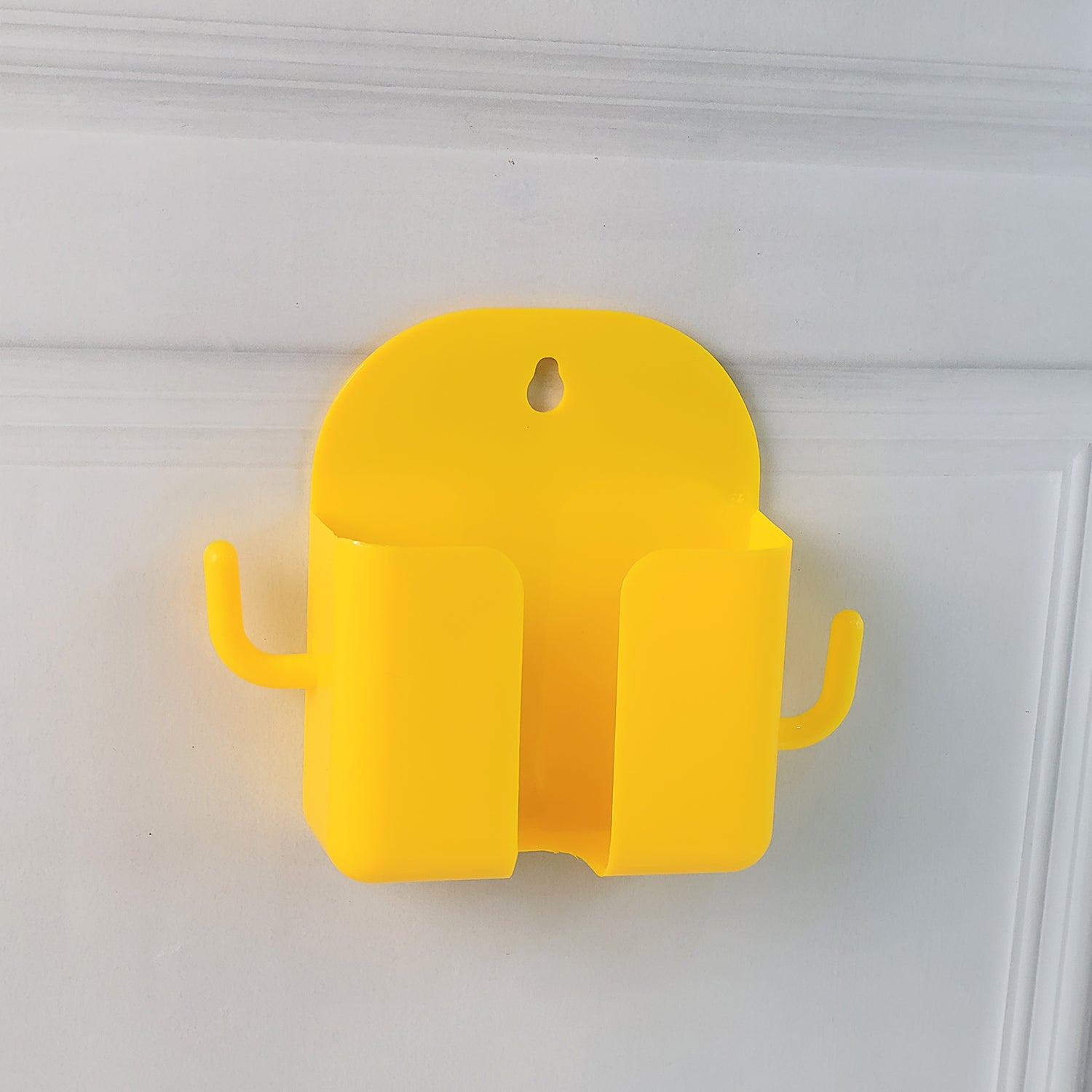 Orange wall-mount mobile stand by Wukusy with hook for holding mobile devices and accessories, mounted on a wall.