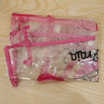 Clear PVC tote bag with top zipper and handles, Wukusy travel bag, showing transparent material and sturdy design.