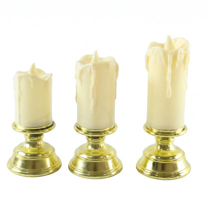 Set of three plastic flameless LED candles with pedestal stands by Wukusy, ideal for decorative display and ambient lighting.