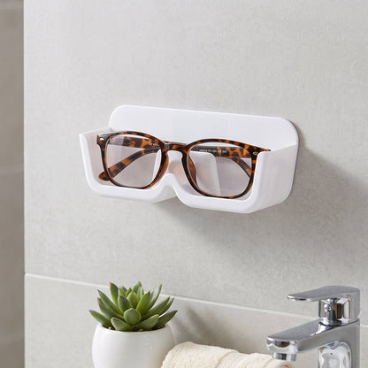 Wall-mounted Wukusy plastic sunglasses holder stand with adhesive, designed for eyewear organization and display.