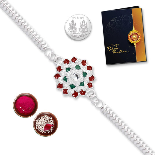 Multicolor crystal flower silver rakhi combo with silver coin tilak set, bracelet, and greeting card for brother from Wukusy.