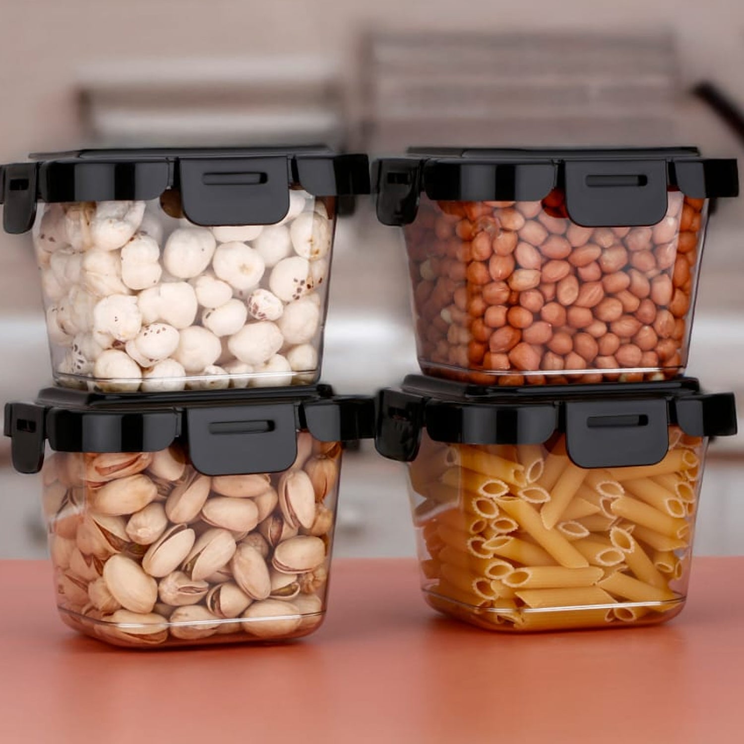 Four Wukusy plastic food storage containers with lids, 500ml capacity, for kitchen organization and food preservation.
