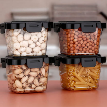 Four Wukusy plastic food storage containers with lids, 500ml capacity, for kitchen organization and food preservation.