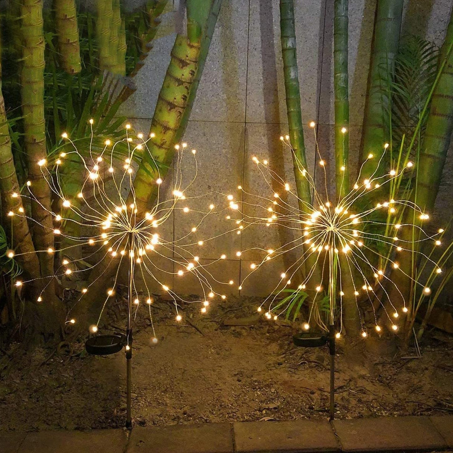 Wukusy solar powered warm white starburst firework garden light set with 120 LED bulbs, ideal for outdoor decorative lighting.