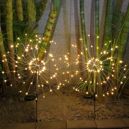 Wukusy solar powered warm white starburst firework garden light set with 120 LED bulbs, ideal for outdoor decorative lighting.