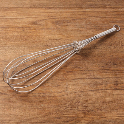 Manual stainless-steel egg beater whisk by Wukusy, showing the sleek, durable handle and wire beaters for mixing eggs and batter.