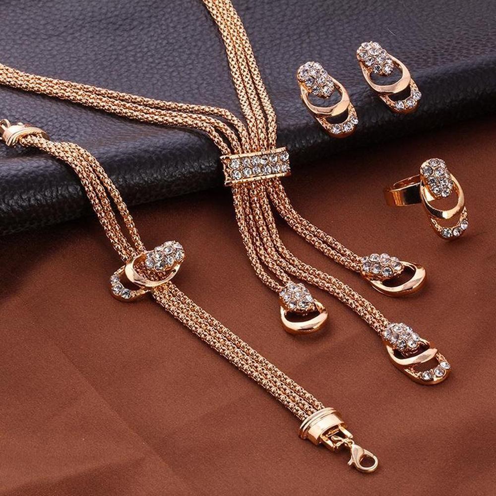 Glistening diamond jewelry set featuring a necklace, earrings, and bracelet with sparkling diamonds and elegant design.