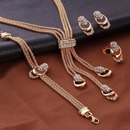 Glistening diamond jewelry set featuring a necklace, earrings, and bracelet with sparkling diamonds and elegant design.