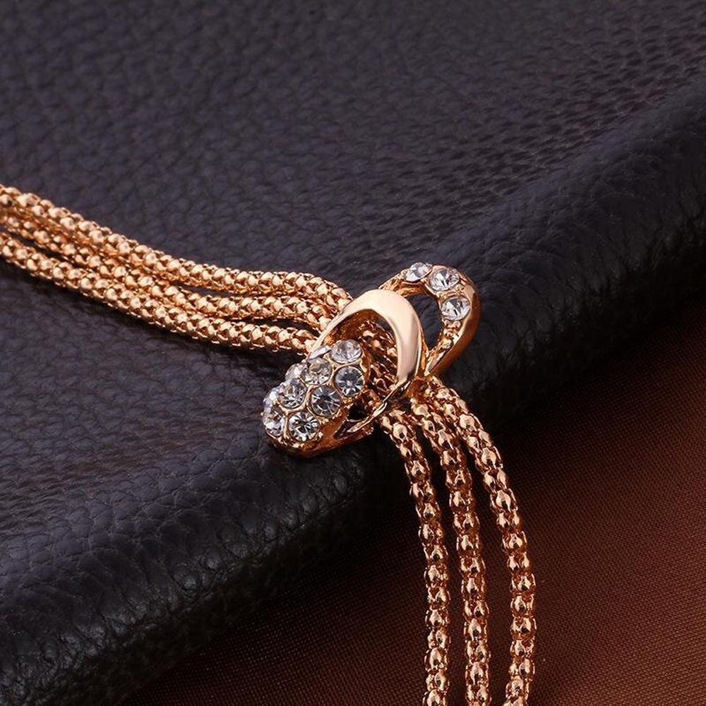 Glistening diamond jewelry set featuring a necklace and earrings with sparkling diamonds, elegant and perfect for special occasions.