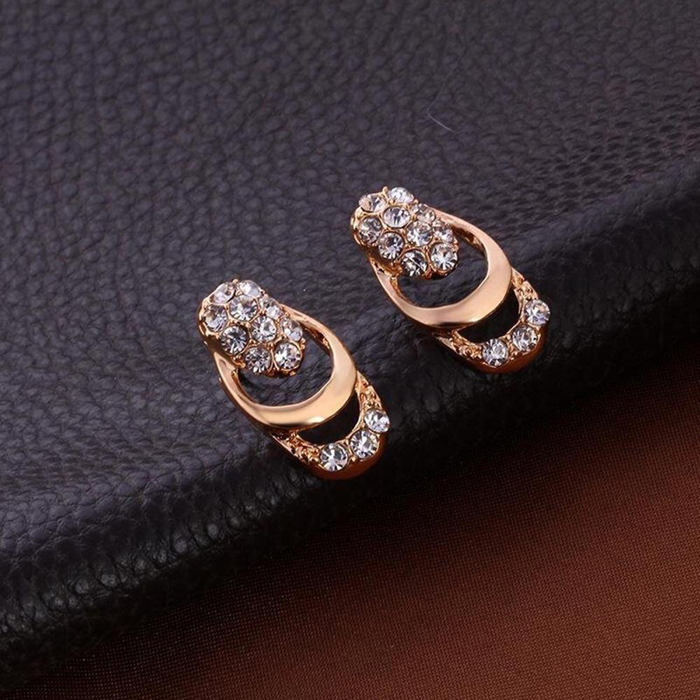 Glistening diamond jewelry set featuring a necklace and earrings with sparkling diamonds and elegant silver settings.