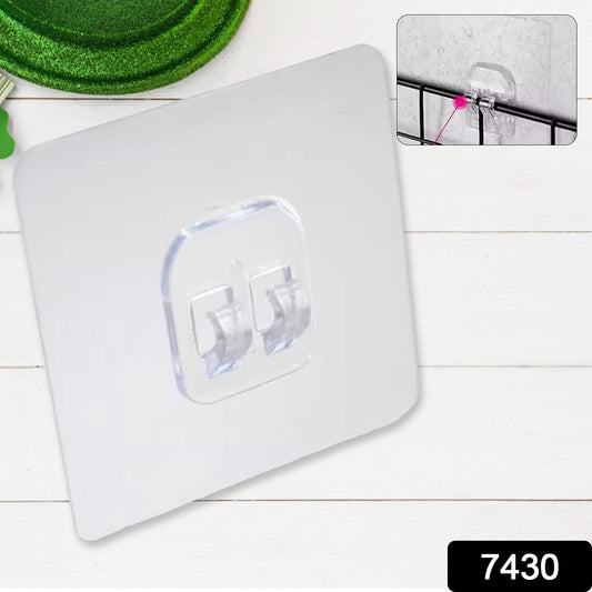 Wukusy 7430 waterproof transparent self-adhesive wall hook mounted on bathroom tile for hanging towels or kitchen utensils.
