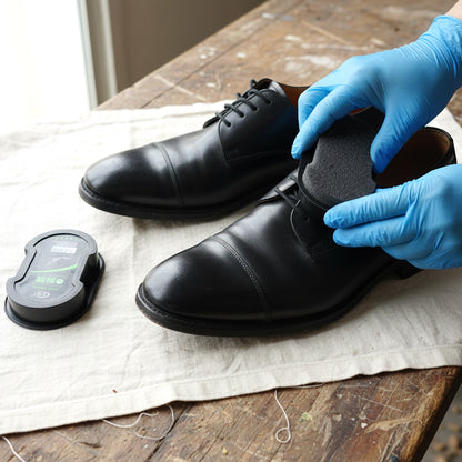Wukusy instant shoe polish sponge applicator for leather shoes, showing the compact black sponge in a close-up image