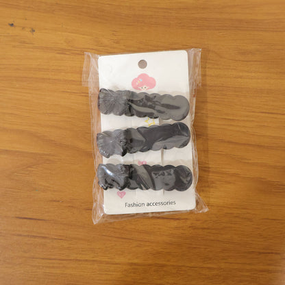 Set of three black bow hair clips by Wukusy, decorative accessories for elegant hair styling.