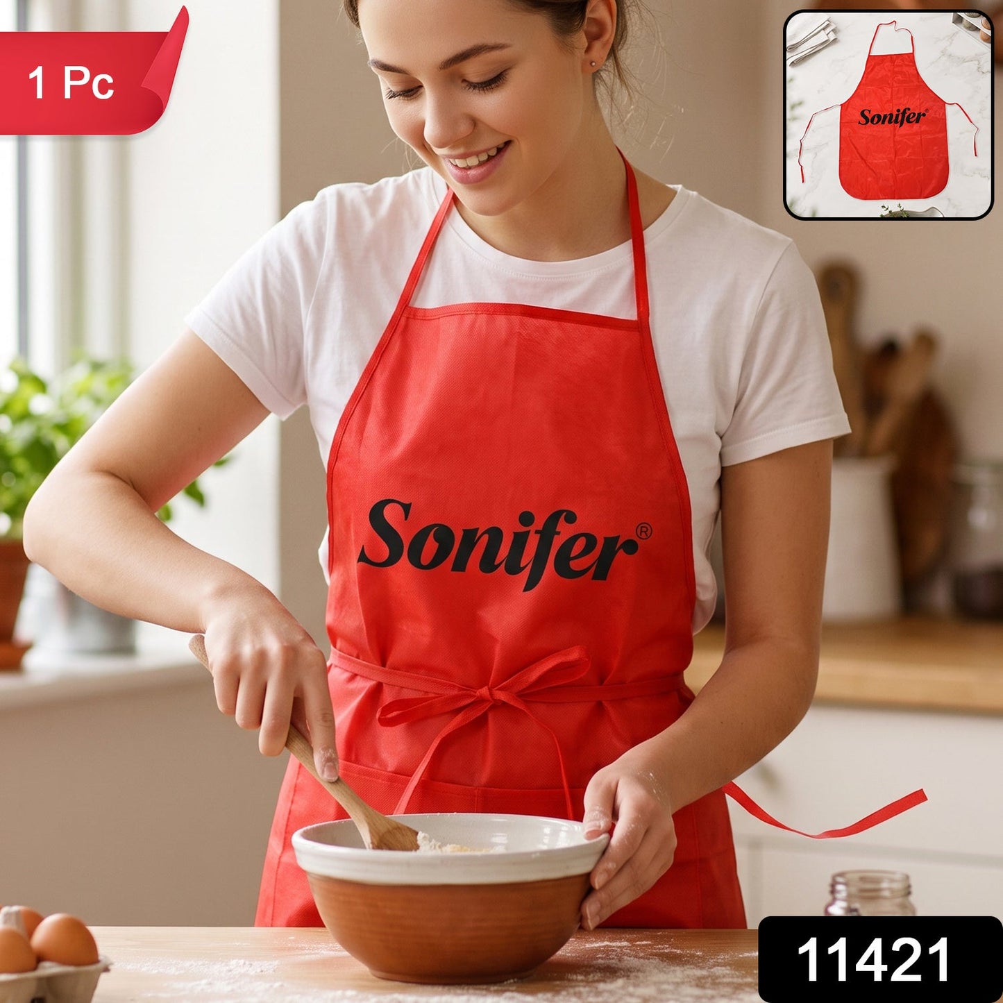 Wukusy reusable cooking apron with front pocket and adjustable neck strap, shown in a kitchen setting.