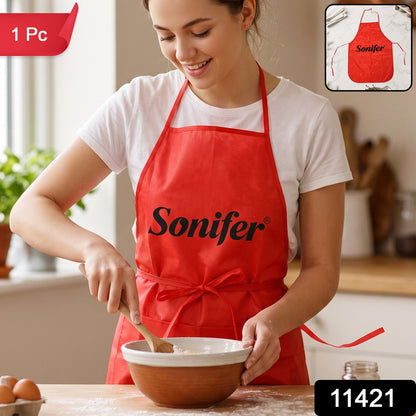 Wukusy reusable cooking apron with front pocket and adjustable neck strap, shown in a kitchen setting.