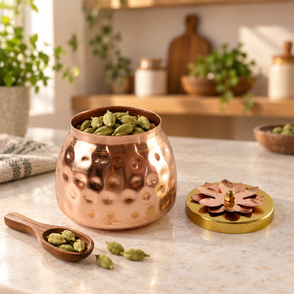 Copper finish storage jar with flower lid for dry fruits, decorative home decor, by Wukusy, shown with a floral lid.