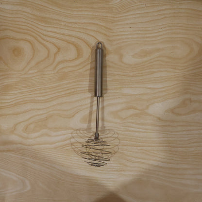 Wukusy stainless steel large round spring whisk for kitchen cooking, designed for beating eggs and mixing ingredients efficiently.