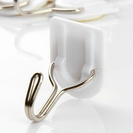 Wukusy 1627 adhesive ABS plastic hook towel hanger for kitchen and bathroom, mounted on a wall for convenient towel hanging.