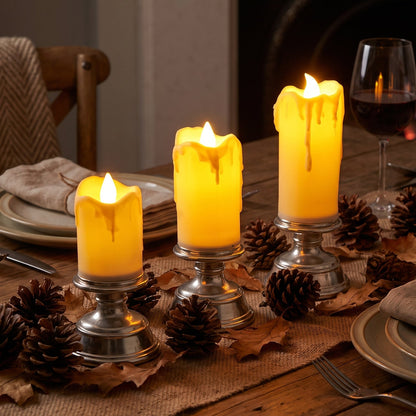 Set of three plastic flameless LED candles with pedestal stands by Wukusy, ideal for decorative display and ambient lighting.