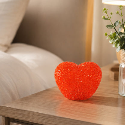 Heart-shaped LED night lamp with crystal texture emitting soft red glow, ideal for cozy bedroom or decor ambiance.
