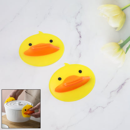 Two cute duck-shaped silicone hot pot holders by Wukusy, featuring bright yellow and orange designs for kitchen safety.