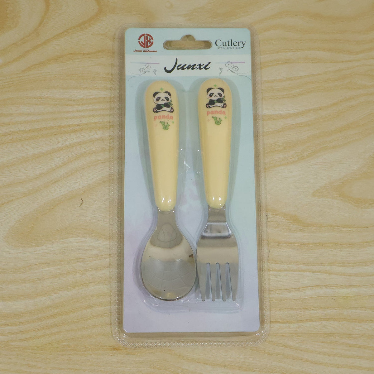 Wukusy kids cartoon spoon and fork set with easy grip handles, ideal for daily feeding, shown with colorful handles and cartoon designs.